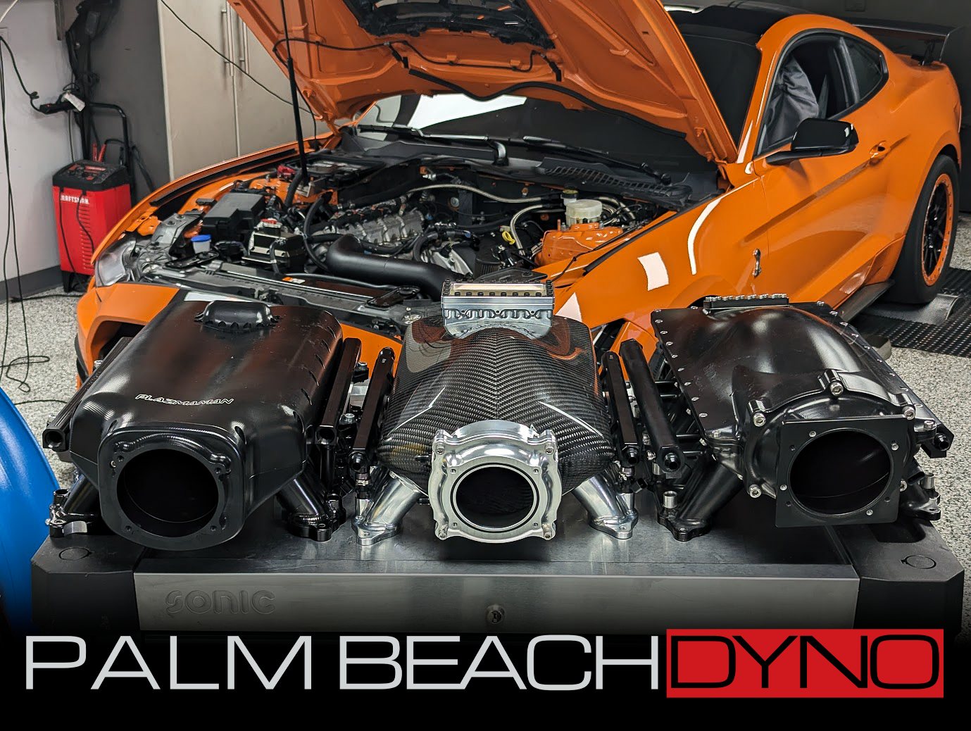 Multiple prototype intake manifold configurations being compared on a Palm Beach Dyno test vehicle